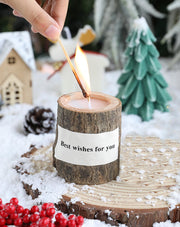 T-shin log aroma candle with wooden holder on table for cozy rustic ambience.