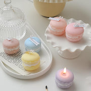 T-Shin macaron shaped candle in green and purple adds soft fragrance to your desk.