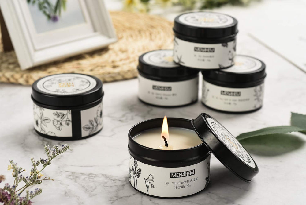 T-shin natural candle in black travel tin creates calming ambience.