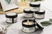 T-shin natural candle in black travel tin creates calming ambience.