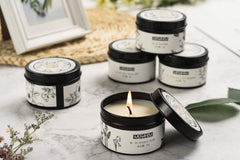 T-shin natural candle in black travel tin creates calming ambience.