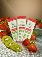 Terra Origin greens packets on-the-go beside a gym bottle for quick nutrition.