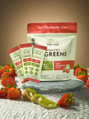 Terra Origin greens packets being poured into a glass for a refreshing energy drink.