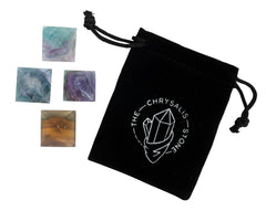 The Chrysalis Stone fluorite pyramid mini wet shot reveals natural shine and density for display