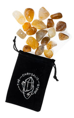 The Chrysalis Stone yellow hematoid quartz in hand, promoting focus and renewed energy.