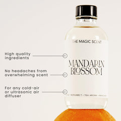 The Magic Scent Mandarin Blossom amber glass bottle on a nightstand, island-inspired aroma