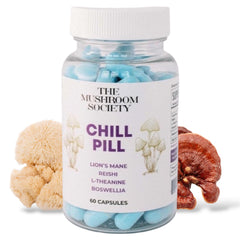 The Mushroom Society Chill Pill bottle on a desk, promoting calm and daily resilience.