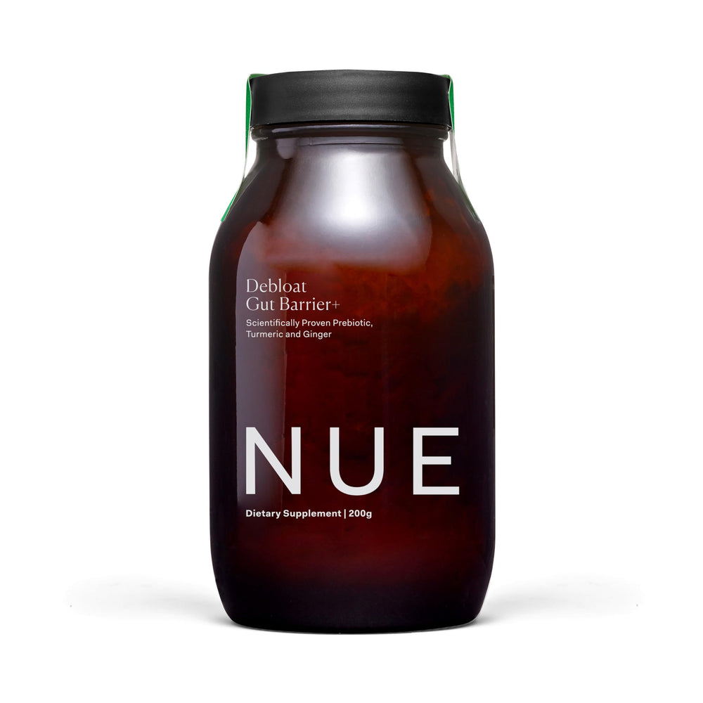 The Nue Co Debloat Gut Barrier+ powder in a jar supports daily digestion.