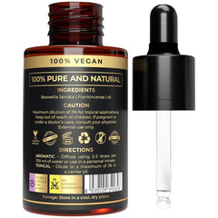 The Organic Forest frankincense oil dropper beside a diffuser for diffusion