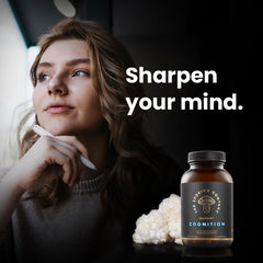 The Sporing Company Mycoveda Cognition bottle on wood surface for home use and daily focus.