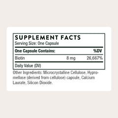 THORNE Biotin capsules closeup showing small, easy-to-swallow tablets.
