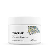 Thorne Magnesium Bisglycinate powder tub on display for daily wellness.
