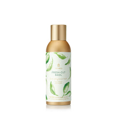 Thymes Fragrance Mist Fresh-Cut Basil bottle highlights a herbaceous, inviting aroma for any room.