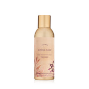 Thymes Sienna Sage mist bottle releasing warm palo santo aroma.