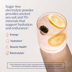 Trace Minerals ZeroLyte berry lemonade mix in glass for refreshing hydration.