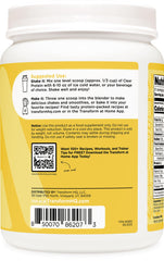 Dissolving TransformHQ Clear Whey Lemonade powder in water for quick nourishment.