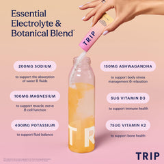 TRIP Electrolyte Peach Yuzu being added to a glass of water