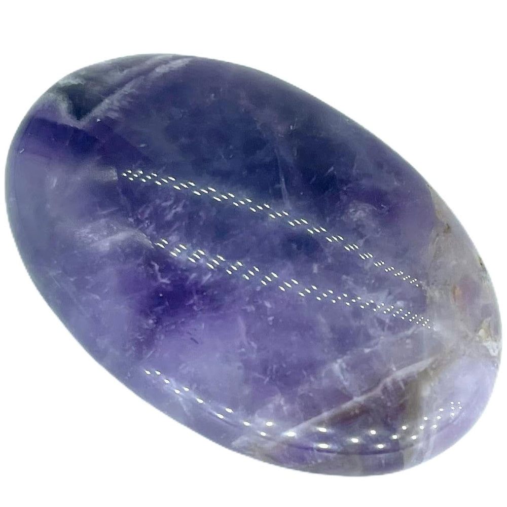 Truewon Amethyst palm stone oval closeup highlighting purple color for meditation