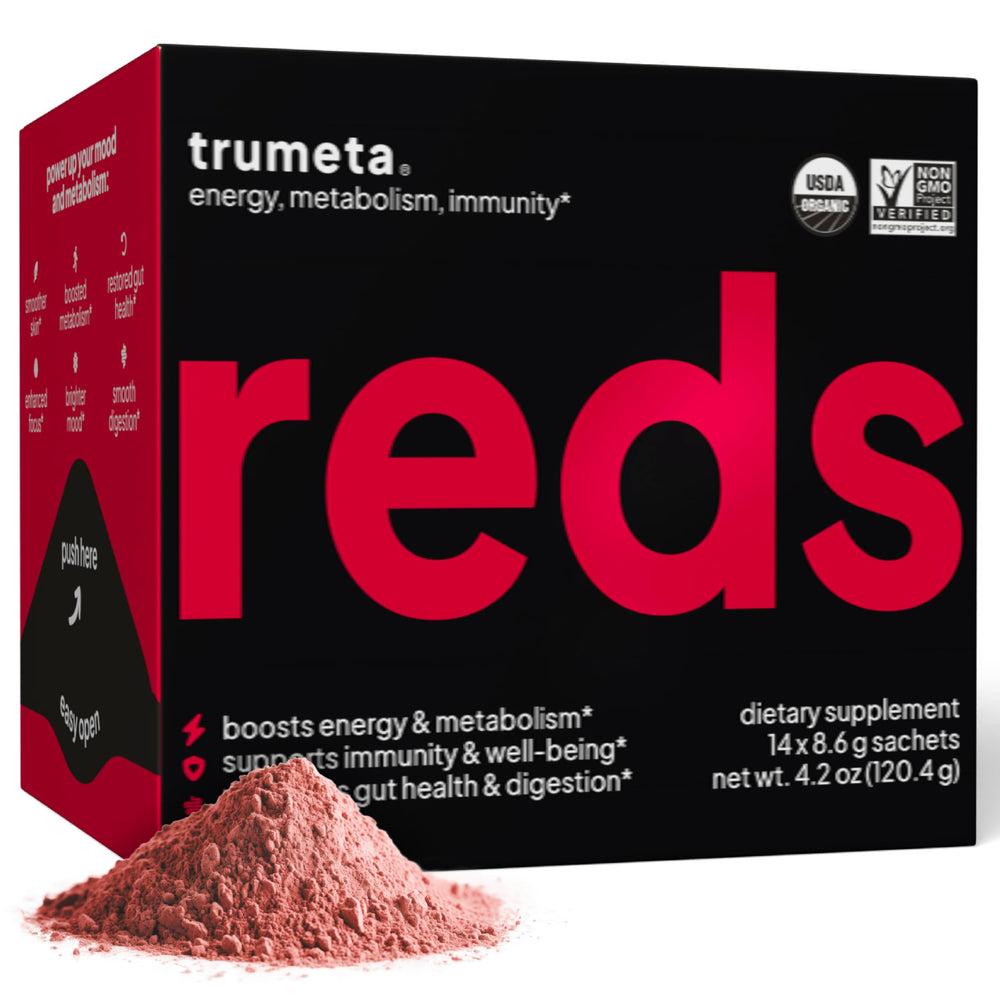 TRUMETA Reds powder packaging on table showing USDA organic certification and convenience for on the go.