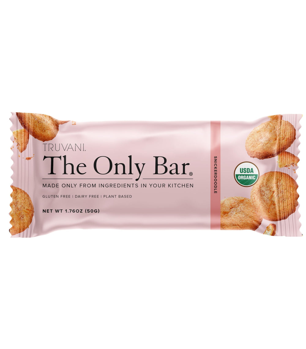Truvani Snickerdoodle bar packaging front shows vegan, organic credentials for on‑the‑go snacking.