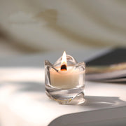 T-shin Lang Lang Cup scented candle glowing on a table for calming ambiance