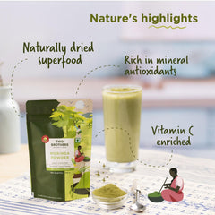 Moringa powder in a glass smoothie with fresh fruit by Two Brothers
