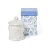 Two's Company Hydrangea Relief Candle in elegant bone porcelain adds botanical charm to decor.