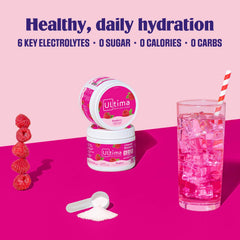 Cold raspberry electrolyte drink in a glass, perfect after workouts.