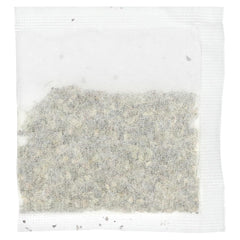 Uncle Lee's Tea Dieters in cup steeping, releasing fragrant herbal notes.