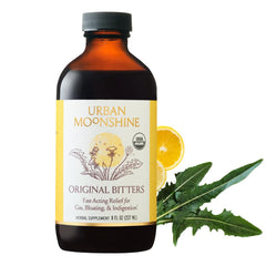 Urban Moonshine Original Digestive Bitters bottle being poured for digestive support.