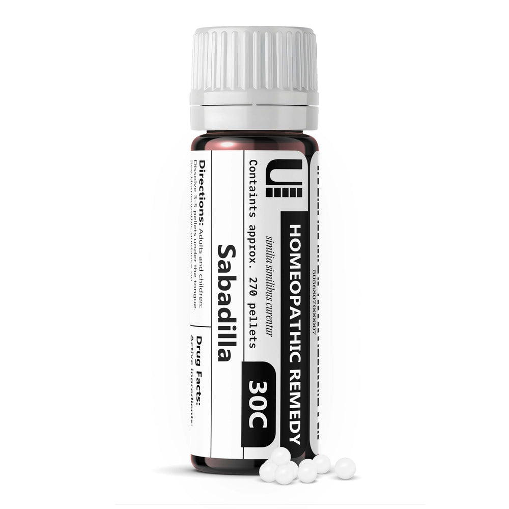 Urenus Sabadilla 30C bottle on shelf, lactose-free homeopathic remedy for sensitive users.