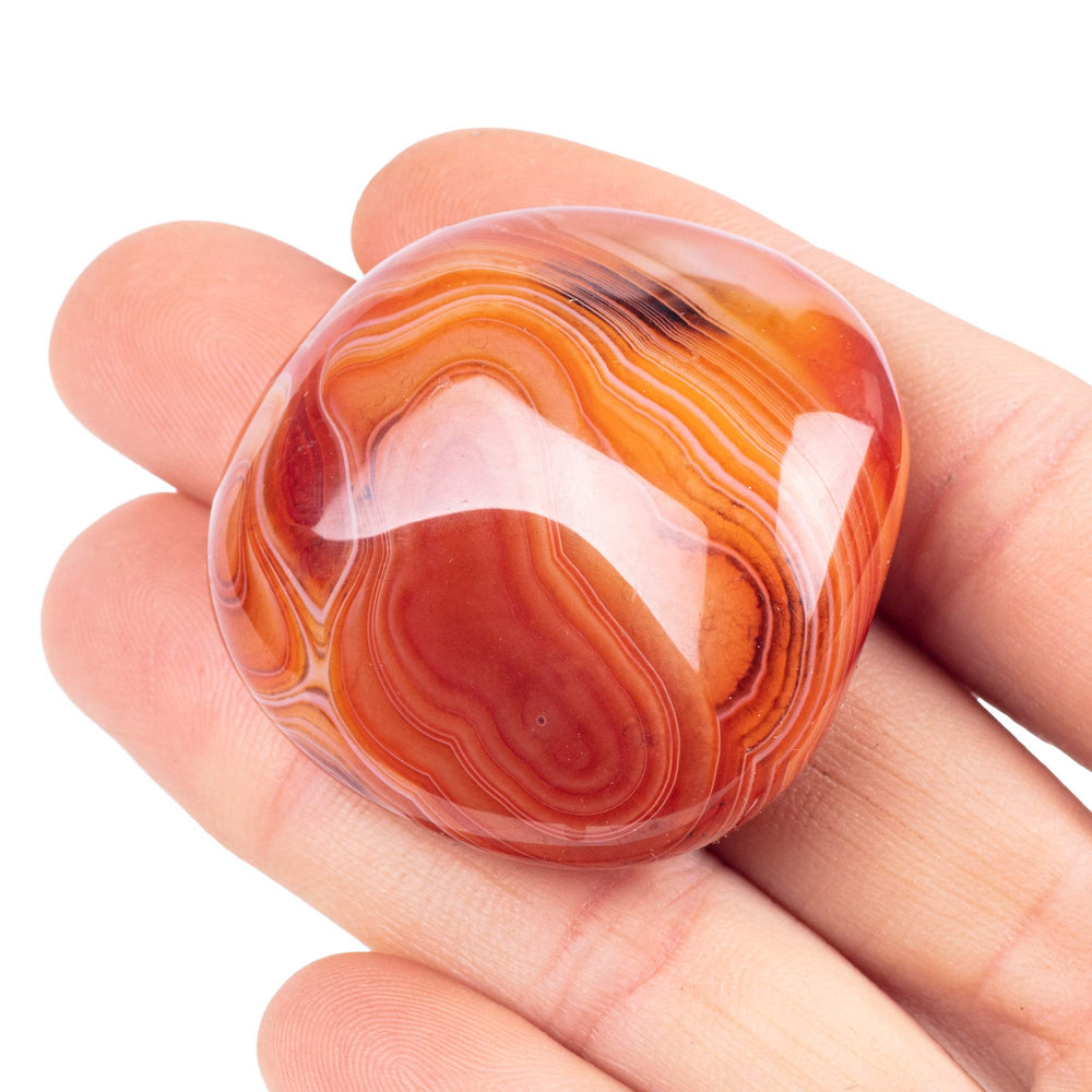 UU UNIHOM worry stone closeup shows natural banding and a smooth palm-friendly surface for calm focus.