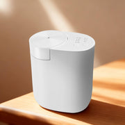 Vasysvi waterless plug-in diffuser in white, compact and wall-friendly for quiet room fragrance