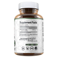 Dispensed capsules from a Vegan Labs ACV bottle suggest daily digestion support.