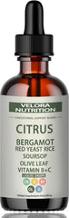 Velora Red Yeast Rice Drops bottle pour shows citrus flavor for daily cholesterol support.