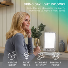 Verilux HappyLight Luxe on desk demonstrates portable design for daily use.