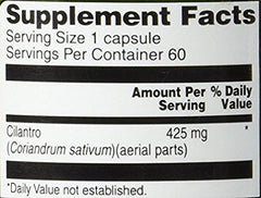 Close-up of Vitacost Cilantro capsules shows compact, easy-to-swallow form.
