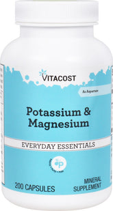 Vitacost Potassium & Magnesium bottle on desk for daily mineral support and convenience.