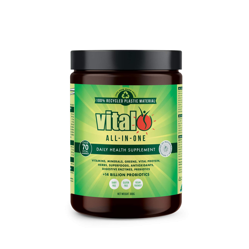 Vital Greens bottle with scoop beside a glass for daily vitality