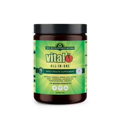 Vital Greens bottle with scoop beside a glass for daily vitality