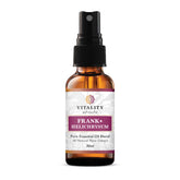 Vitality Frankincense and Helichrysum spray bottle pour releasing a soothing, grounding aroma