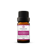 Vitality Helichrysum essential oil bottle pour for skin care and aromatherapy.