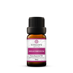 Vitality Helichrysum essential oil bottle pour for skin care and aromatherapy.