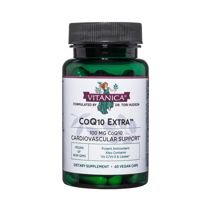 Vitanica CoQ10 Extra bottle on table signaling vegan, non-GMO daily wellness.