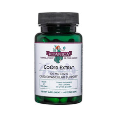 Vitanica CoQ10 Extra bottle on table signaling vegan, non-GMO daily wellness.