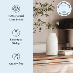 Vitruvi Forest Frost diffuser in a living room highlighting long-lasting aroma.