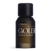 Vitruvi Golden bottle close-up showcases the citrus-spice blend for uplifting spaces