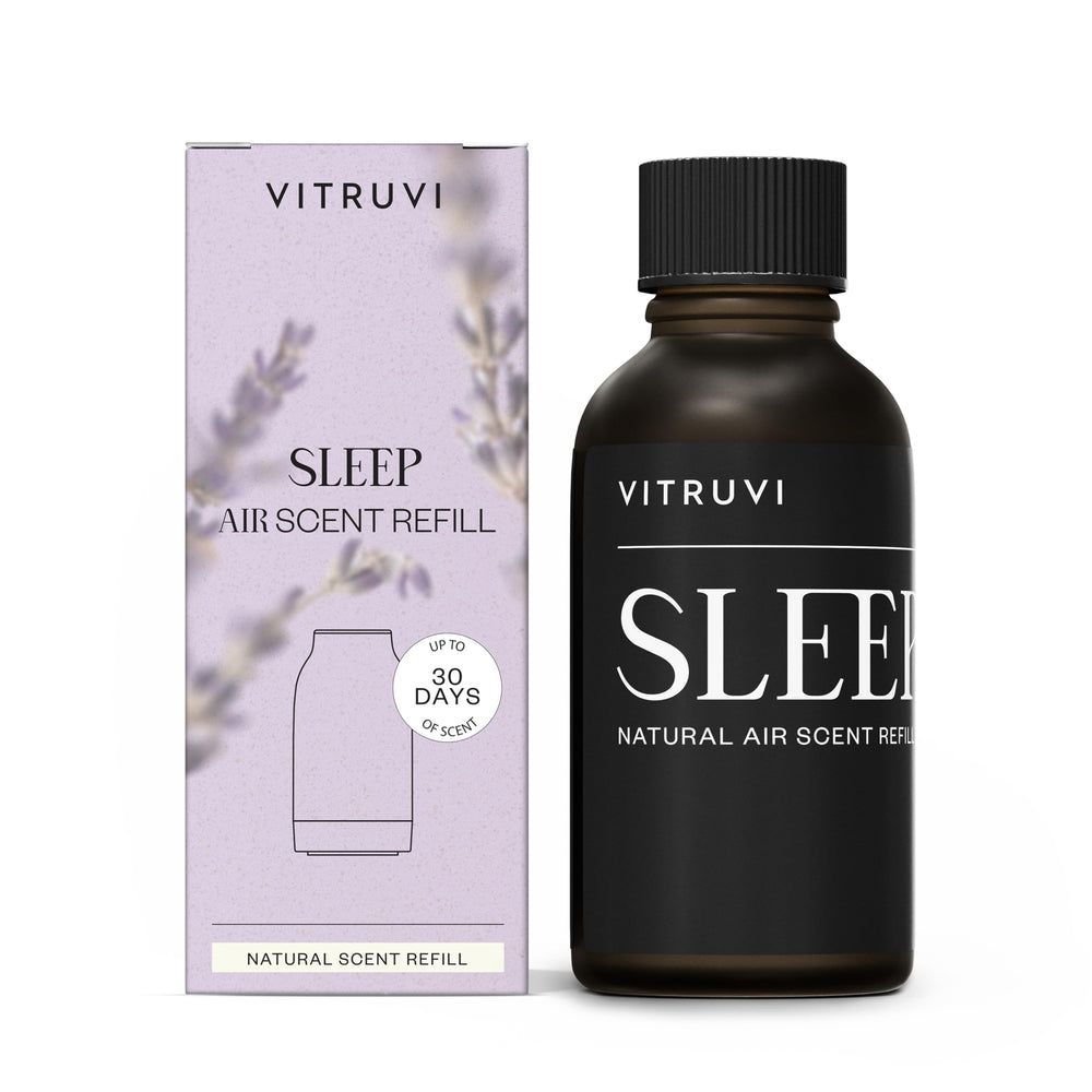 Vitruvi Sleep Scent Refill bottle closeup showing lavender, chamomile, and frankincense for calming bedtime scent.