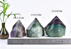 VIZYTOU fluorite wand held in hand demonstrates portable meditation aid