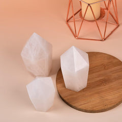VIZYTOU healing crystal tower on a desk promotes calm ambiance in home or office.